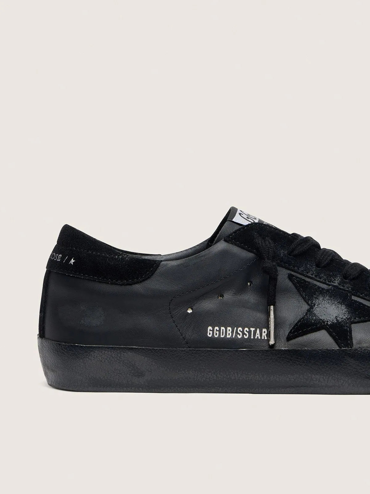 Golden Goose Men's
Super-Star in black nappa with black suede star and heel tab
